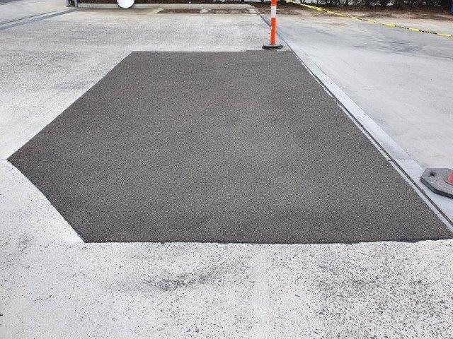 Concrete repair patch on industrial surface