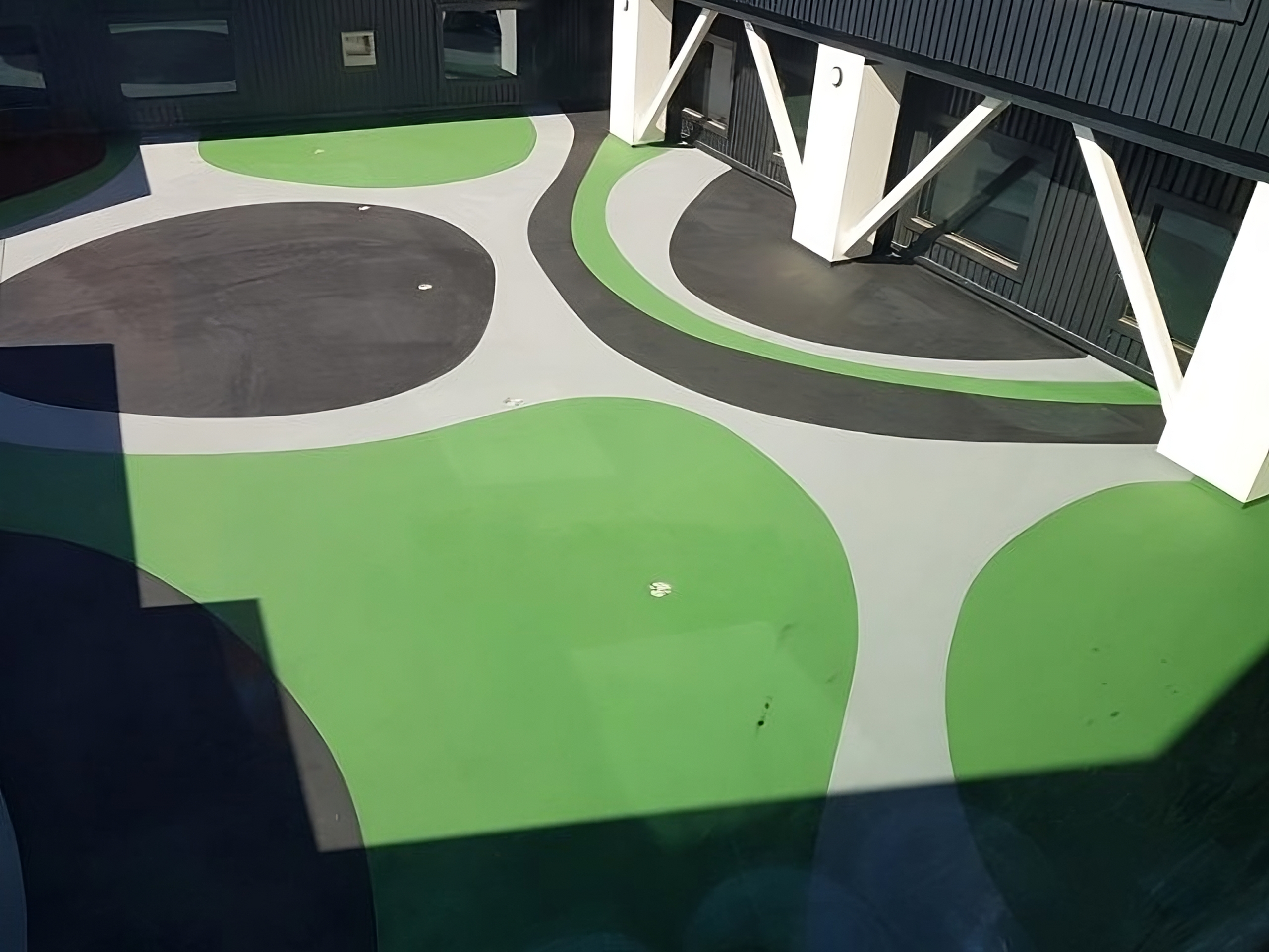 Decorative concrete resurfacing with coloured markings